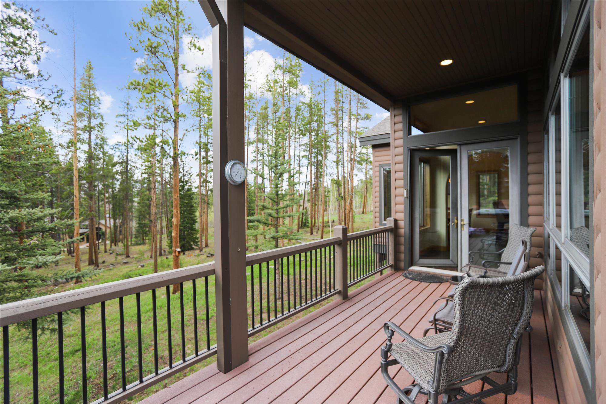 Sit in the warm sun on a summer day and enjoy the views from this large patio - Evergreen Lodge Breckenridge Vacation Rental