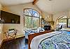 Enjoy a relaxing evening in this spacious master bedroom - Evergreen Lodge Breckenridge Vacation Rental 