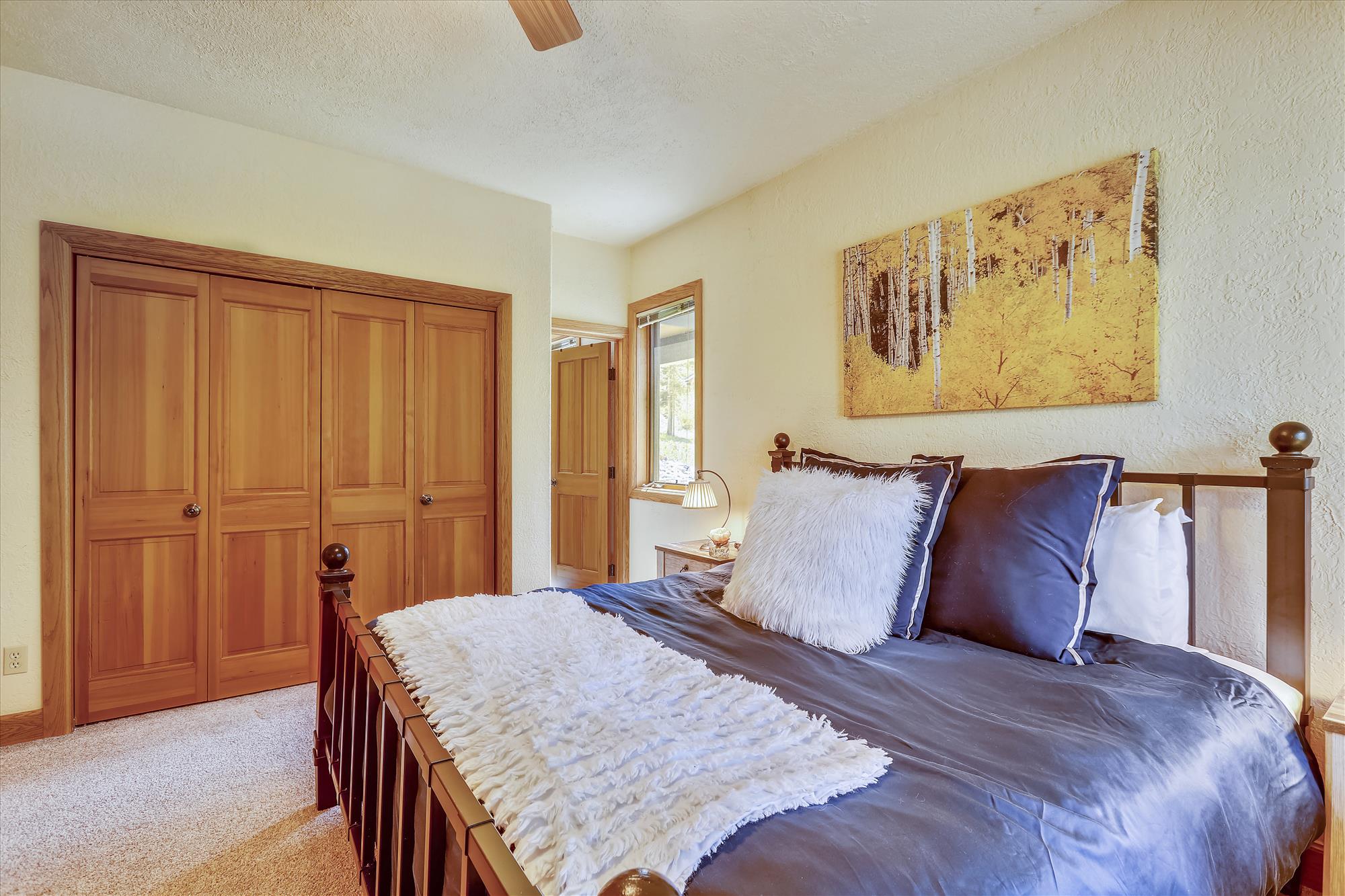 Additional king bedroom view with entryway to private bathroom and spacious closet - Evergreen Lodge Breckenridge Vacation Rental