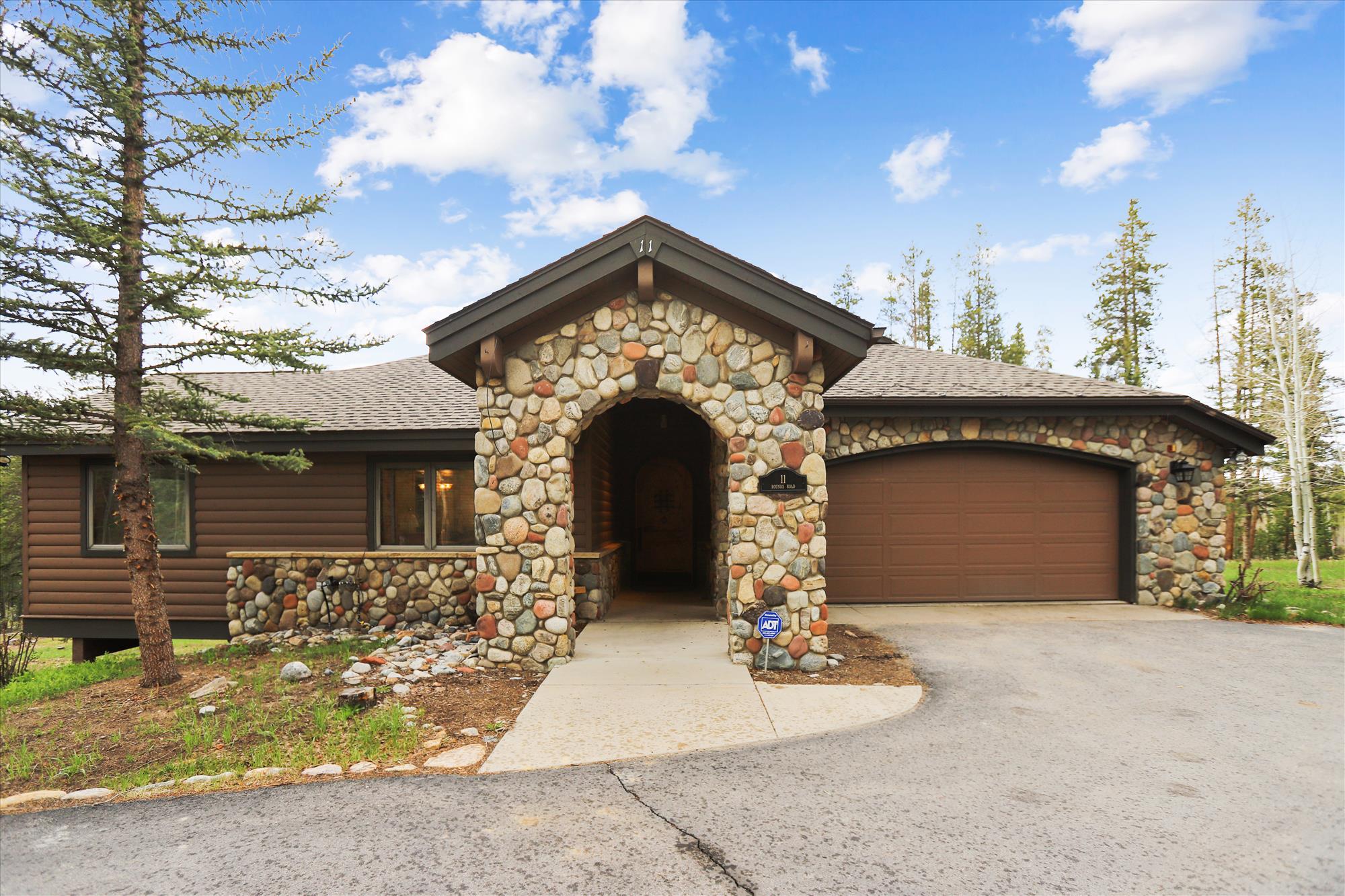 Exterior view with entryway and two car garage - Evergreen Lodge Breckenridge Vacation Rental