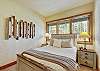 Wind down and relax in this cozy queen bedroom - Evergreen Lodge Breckenridge Vacation Rental 