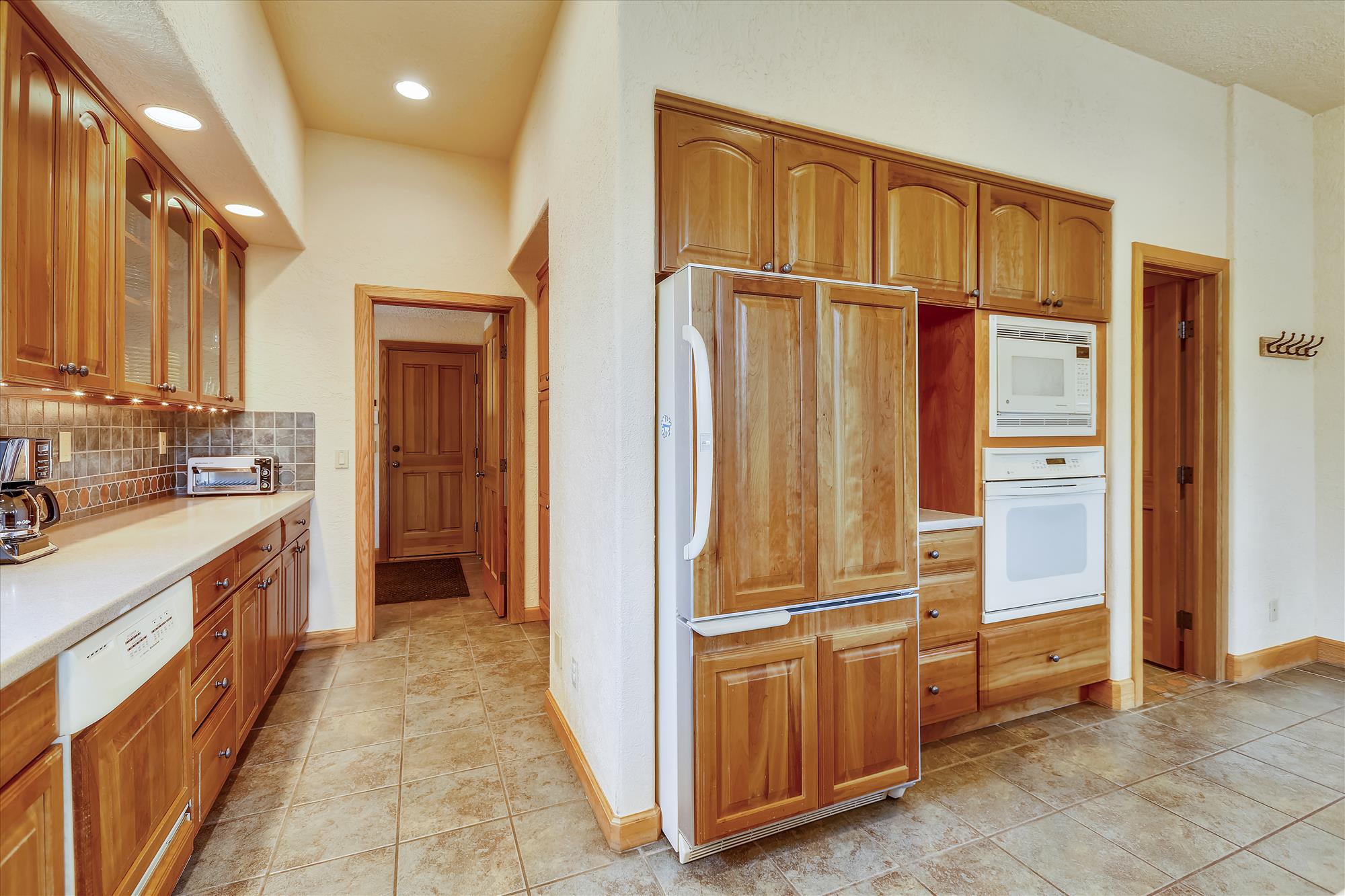 This spacious kitchen offers all of the storage space and walking room to host a large party - Evergreen Lodge Breckenridge Vacation Rental