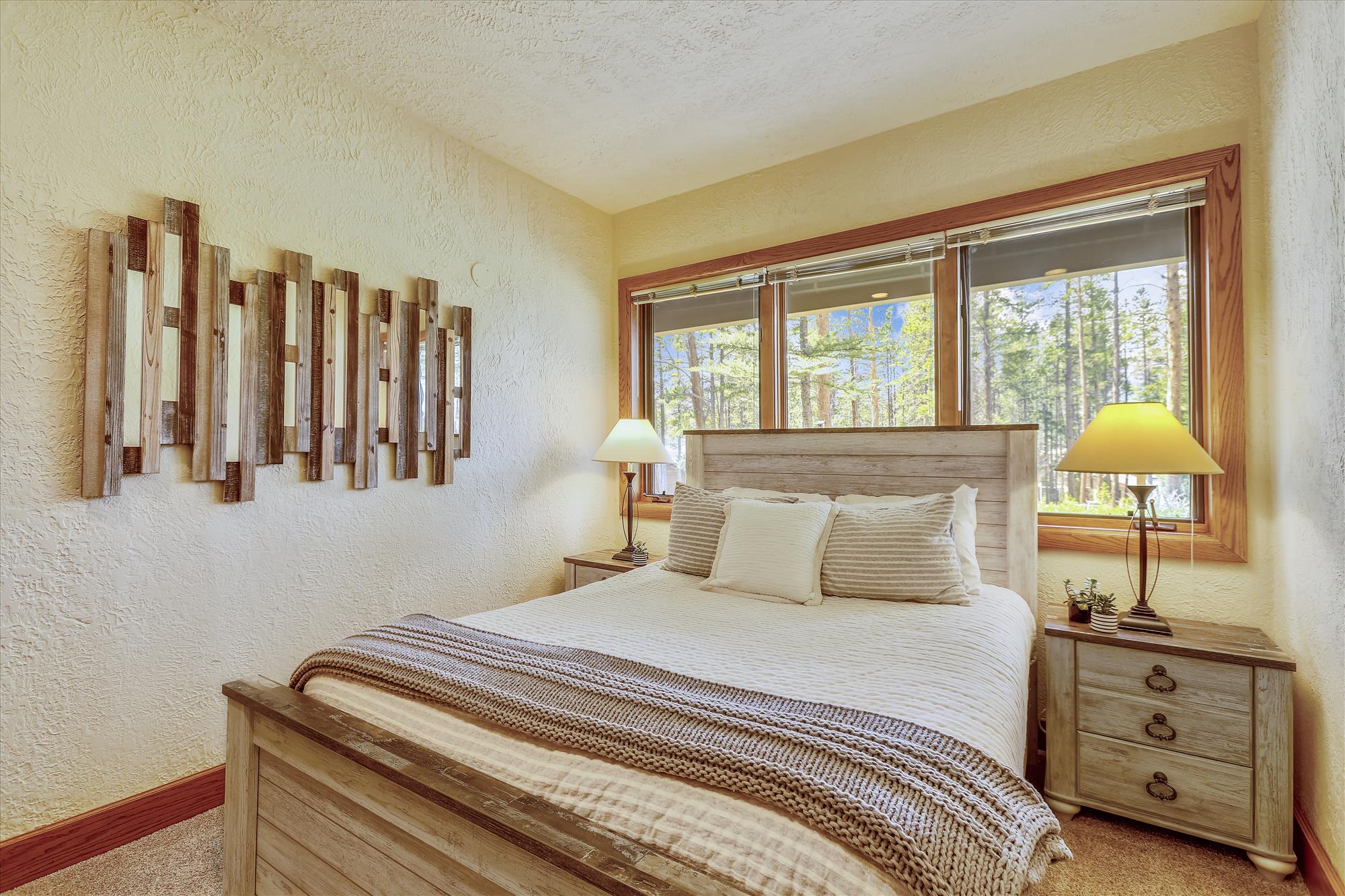 Wind down and relax in this cozy queen bedroom - Evergreen Lodge Breckenridge Vacation Rental