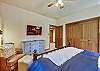 This king bedroom offers a spacious closet and flat-screen TV - Evergreen Lodge Breckenridge Vacation Rental 