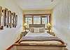 Bottom floor queen bedroom with a beautiful secluded view - Evergreen Lodge Breckenridge Vacation Rental 