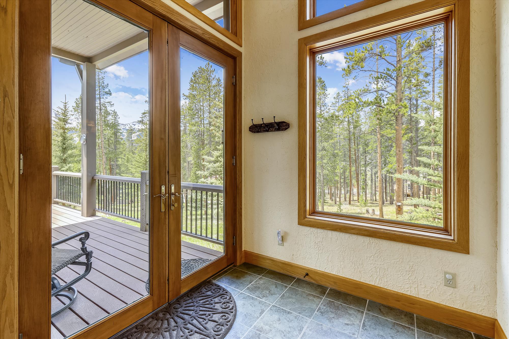 Exit from the dining room to the large patio - Evergreen Lodge Breckenridge Vacation Rental