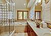 Ensuit master bathroom with large jetted soaking tub and walk-in shower - Evergreen Lodge Breckenridge Vacation Rental 