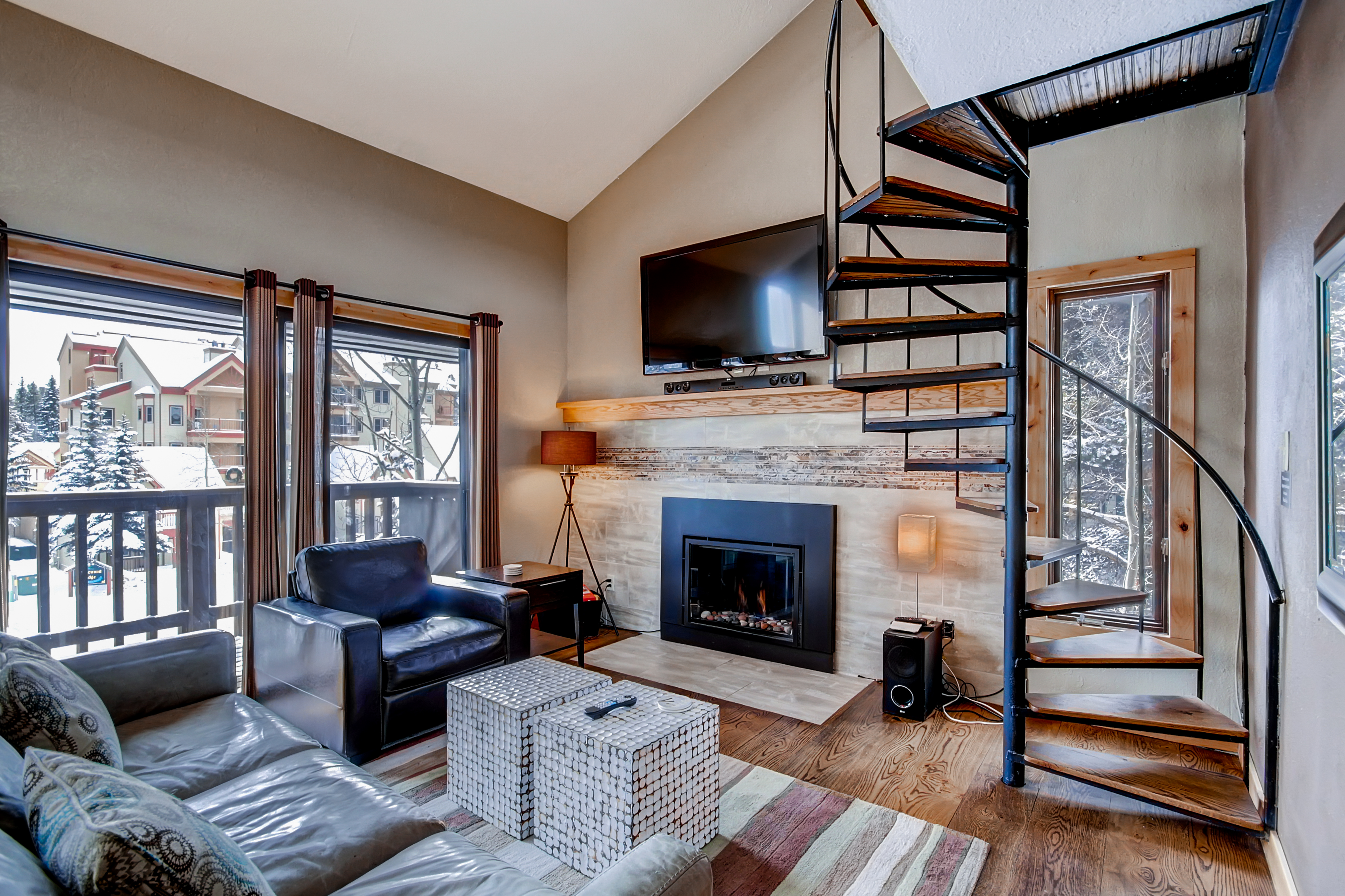 Relax by the gas fireplace in the cozy living room.