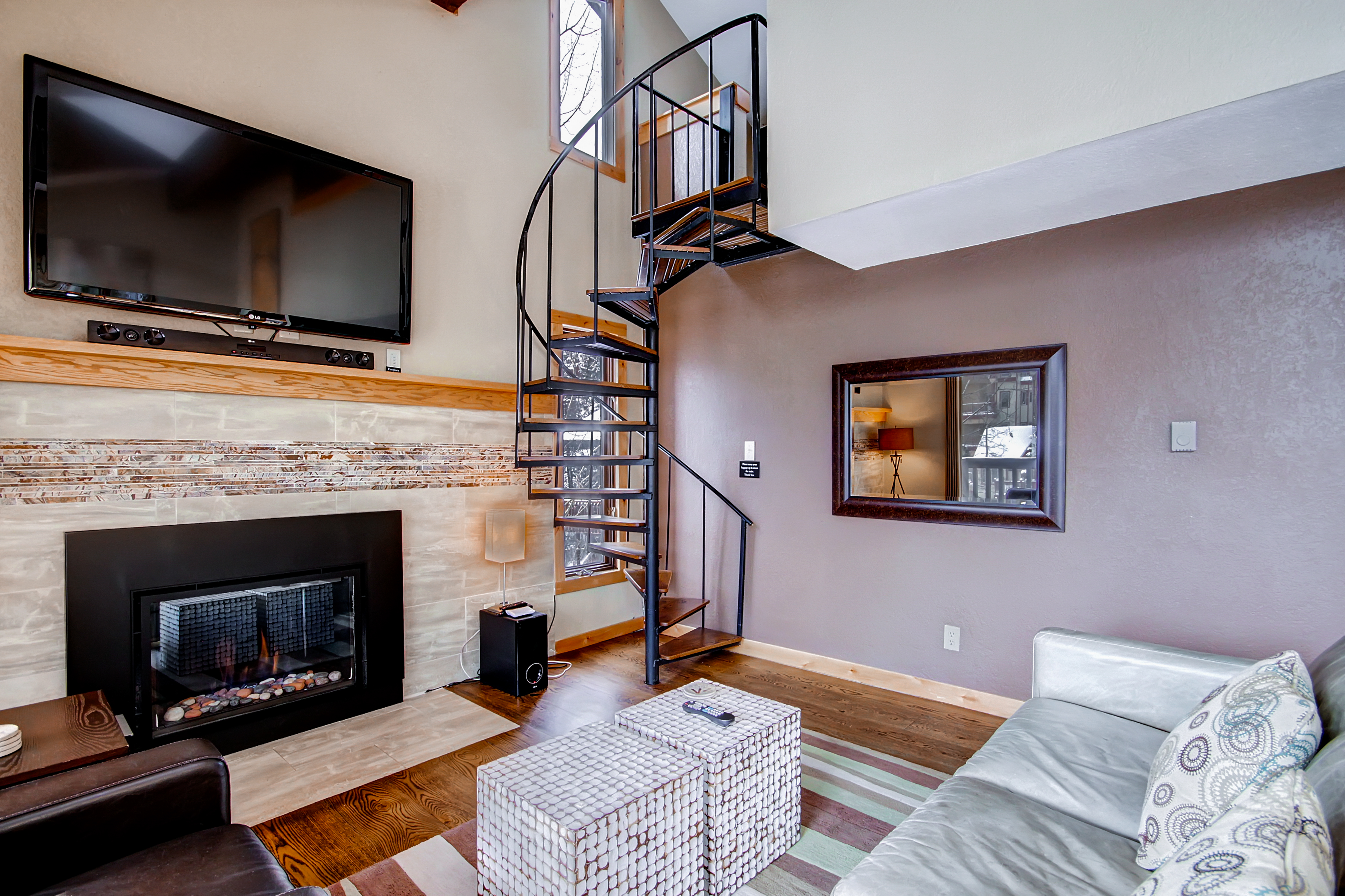 Spiral staircase leads up to the loft - 4 O’Clock Lodge A16 Breckenridge Vacation Rental