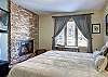 Enjoy the flat screen TV in the lower level King bedroom - 4 O’Clock Lodge D26 Breckenridge Vacation Rental 