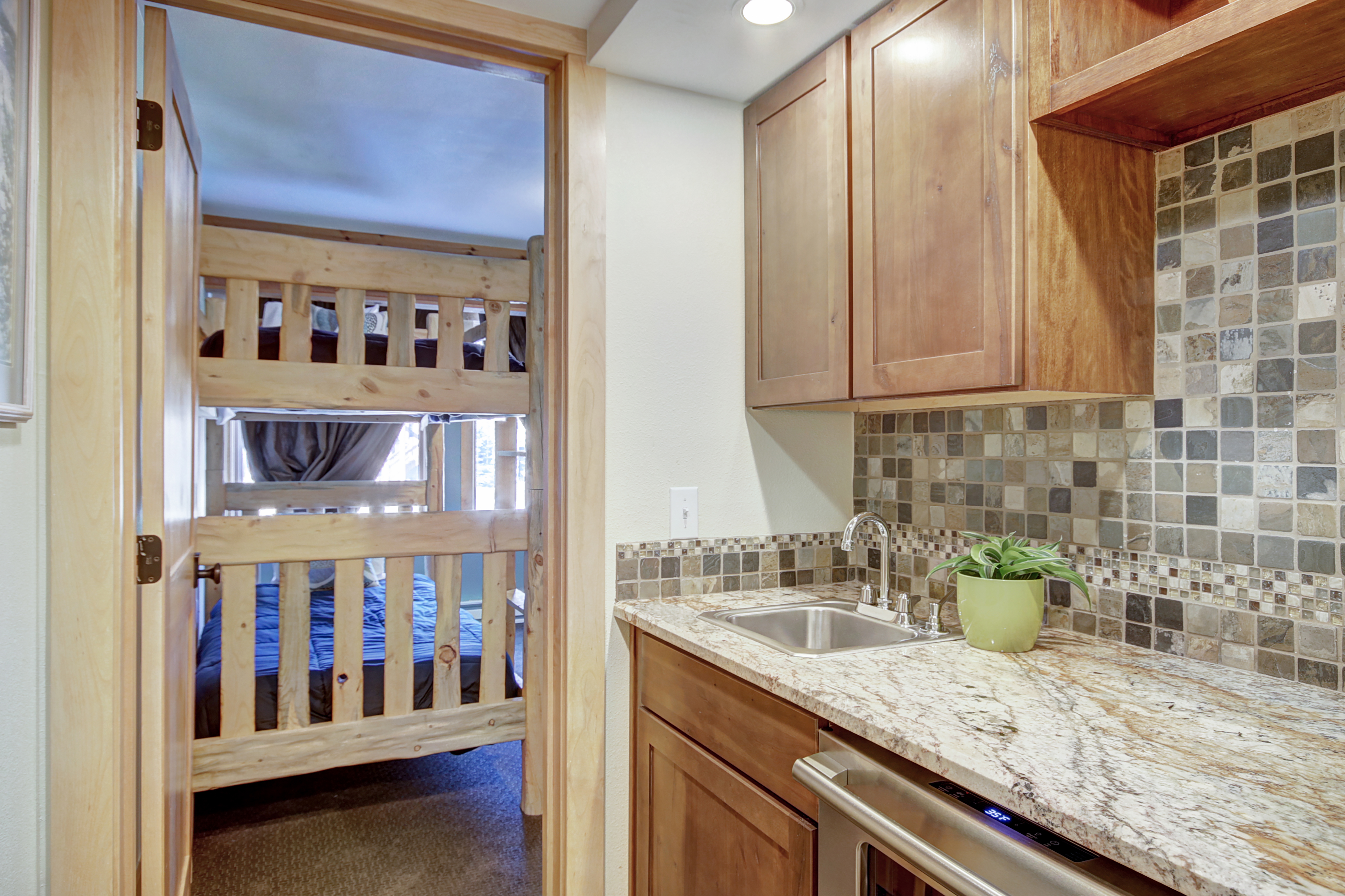 Convenient wet bar located in the lower level hallway - 4 O’Clock Lodge D26 Breckenridge Vacation Rental
