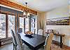 Watch the snow fall as you enjoy a meal at the dining table that can seat 10 - 4 O’Clock Lodge D26 Breckenridge Vacation Rental 