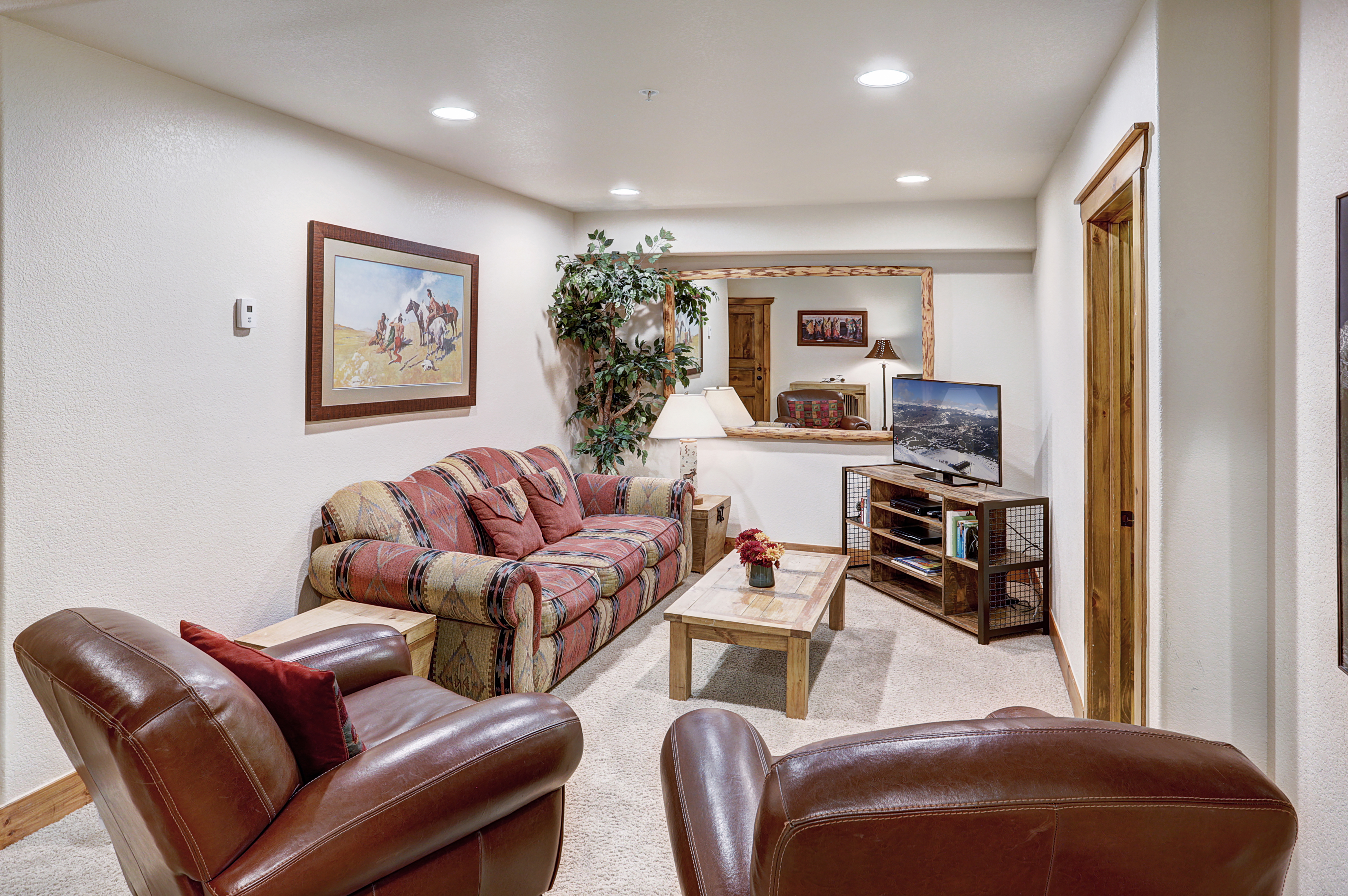 Lower level living area with a pullout couch for extra sleeping arrangements - Amber Sky Breckenridge Vacation Rental