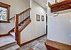 Store your shoes and winter gear in the entryway coat closet and bench storage - Amber Sky Breckenridge Vacation Rental 
