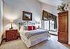 Master bedroom with natural light and vaulted ceilings - Amber Sky Breckenridge Vacation Rental 