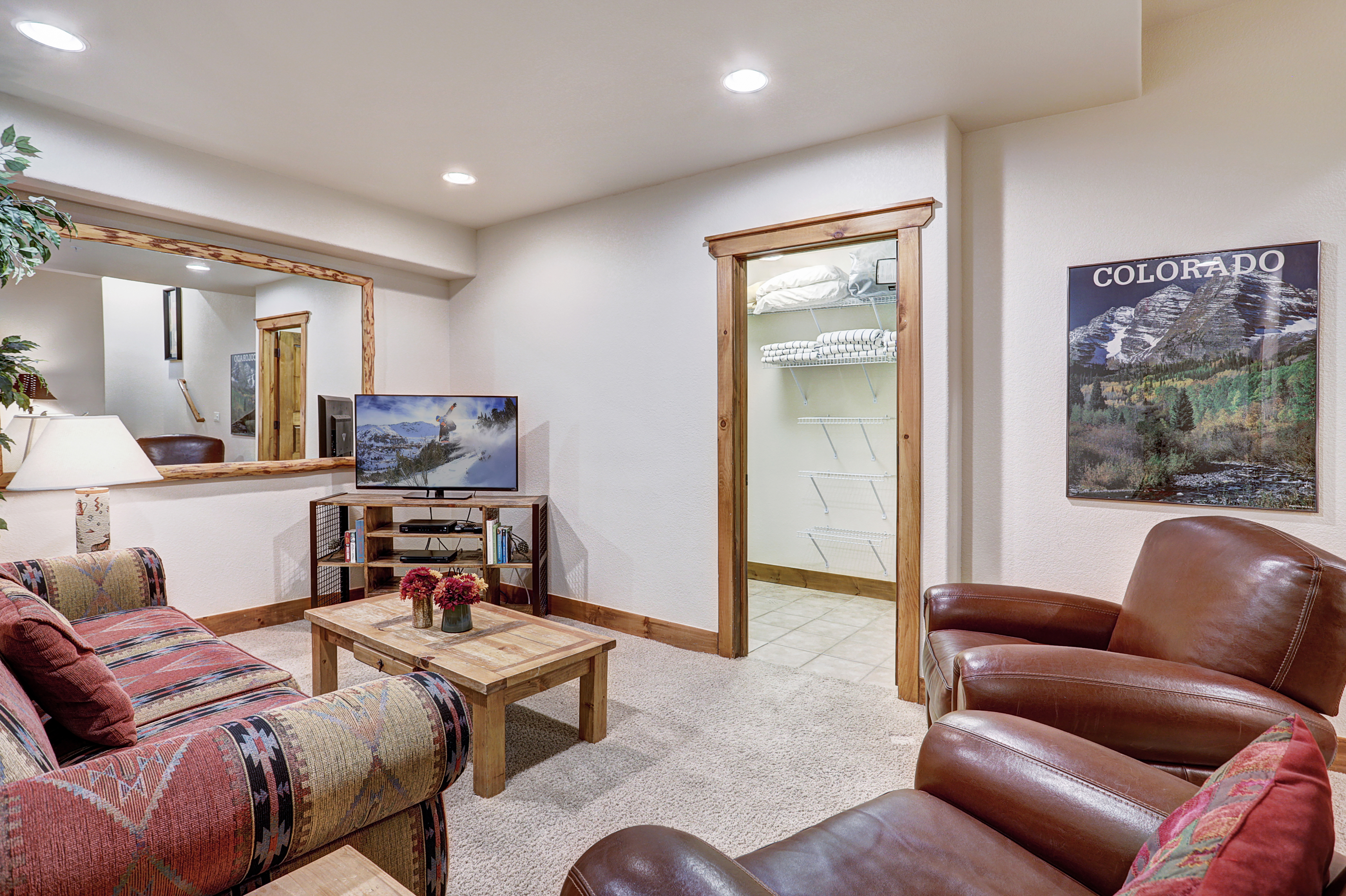 Watch a movie with friends and family in this lower level living space - Amber Sky Breckenridge Vacation Rental