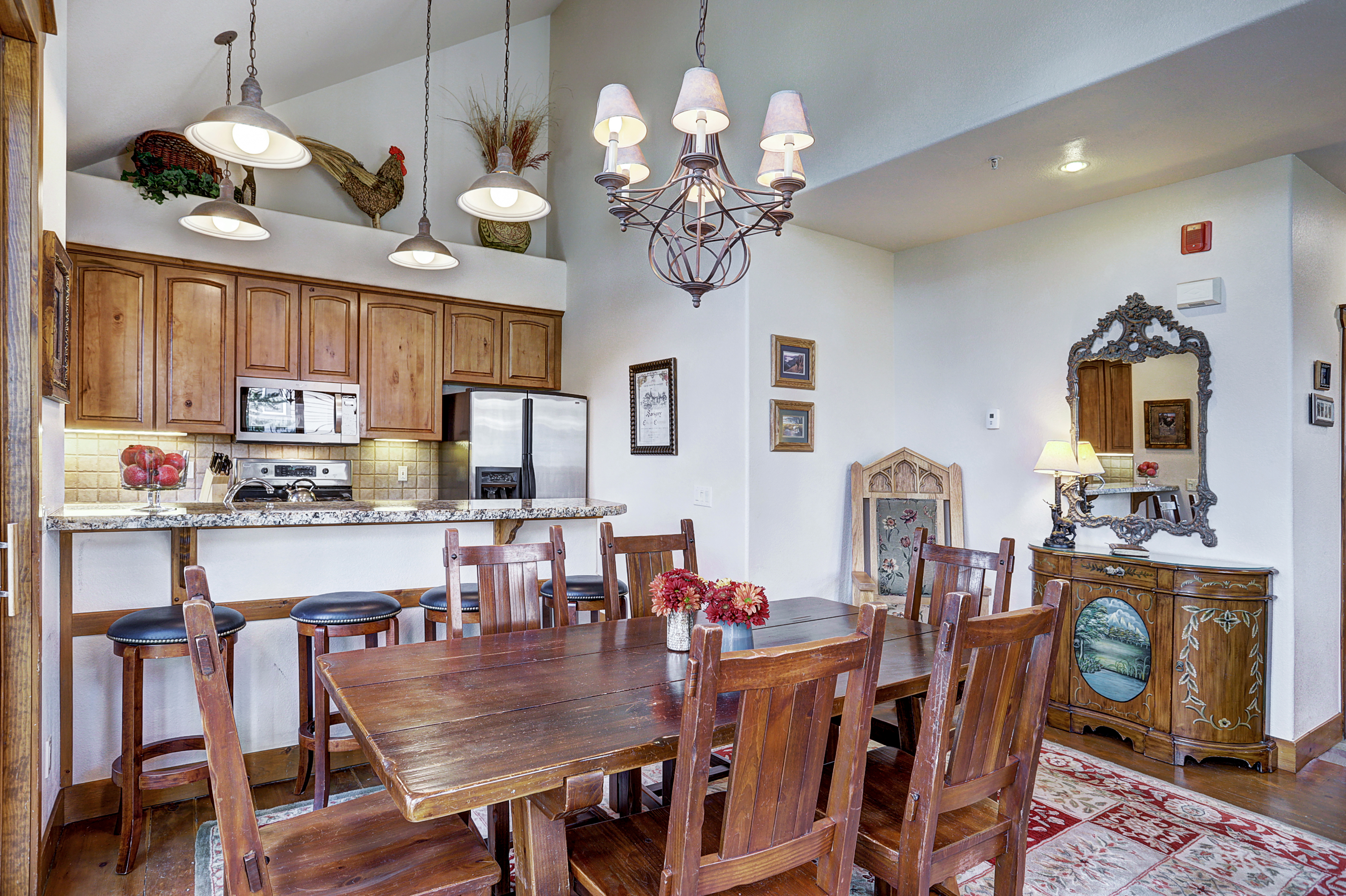 Seat 6 at this dining table with 4 extra spaces at the kitchen island - Amber Sky Breckenridge Vacation Rental