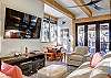 Relax on the living room sectional sofa to take in the wooded view or a watch a movie on the flat screen TV - Arrow Darrow Breckenridge Vacation Rental 