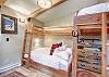 Bungalow bunk room with Twin over Queen bunks and Twin size sleeper chair - Arrow Darrow Breckenridge Vacation Rental 