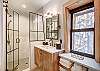 Upper level bunk room shared bath with walk-in shower and 1 sink - Arrow Darrow Breckenridge Vacation Rental 