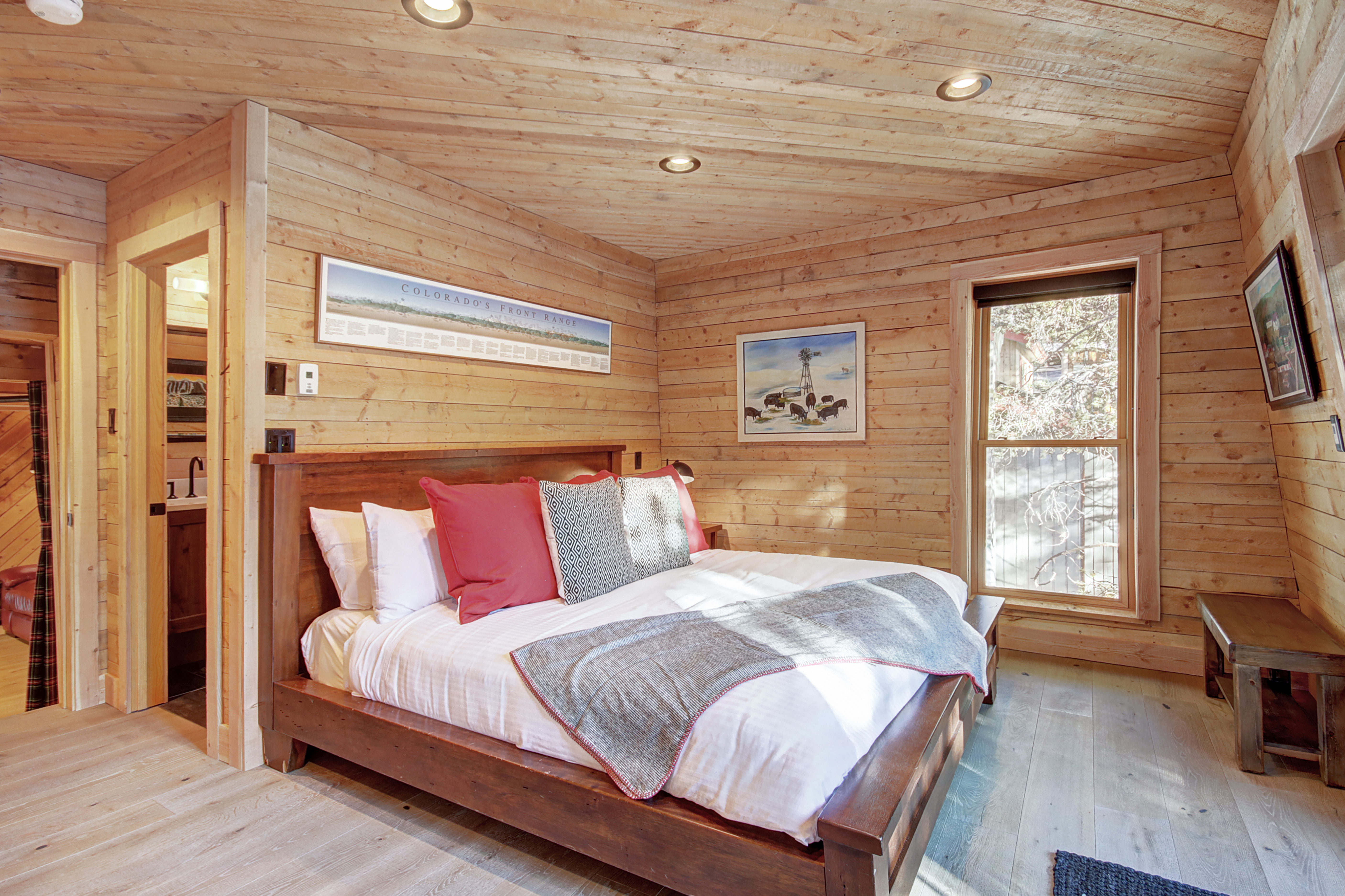 Upper level master suite with King-size bed, private deck, and private bath