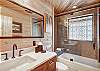 Upper level master suite private bath with bathtub/shower combination and 1 sink - Arrow Darrow Breckenridge Vacation Rental 