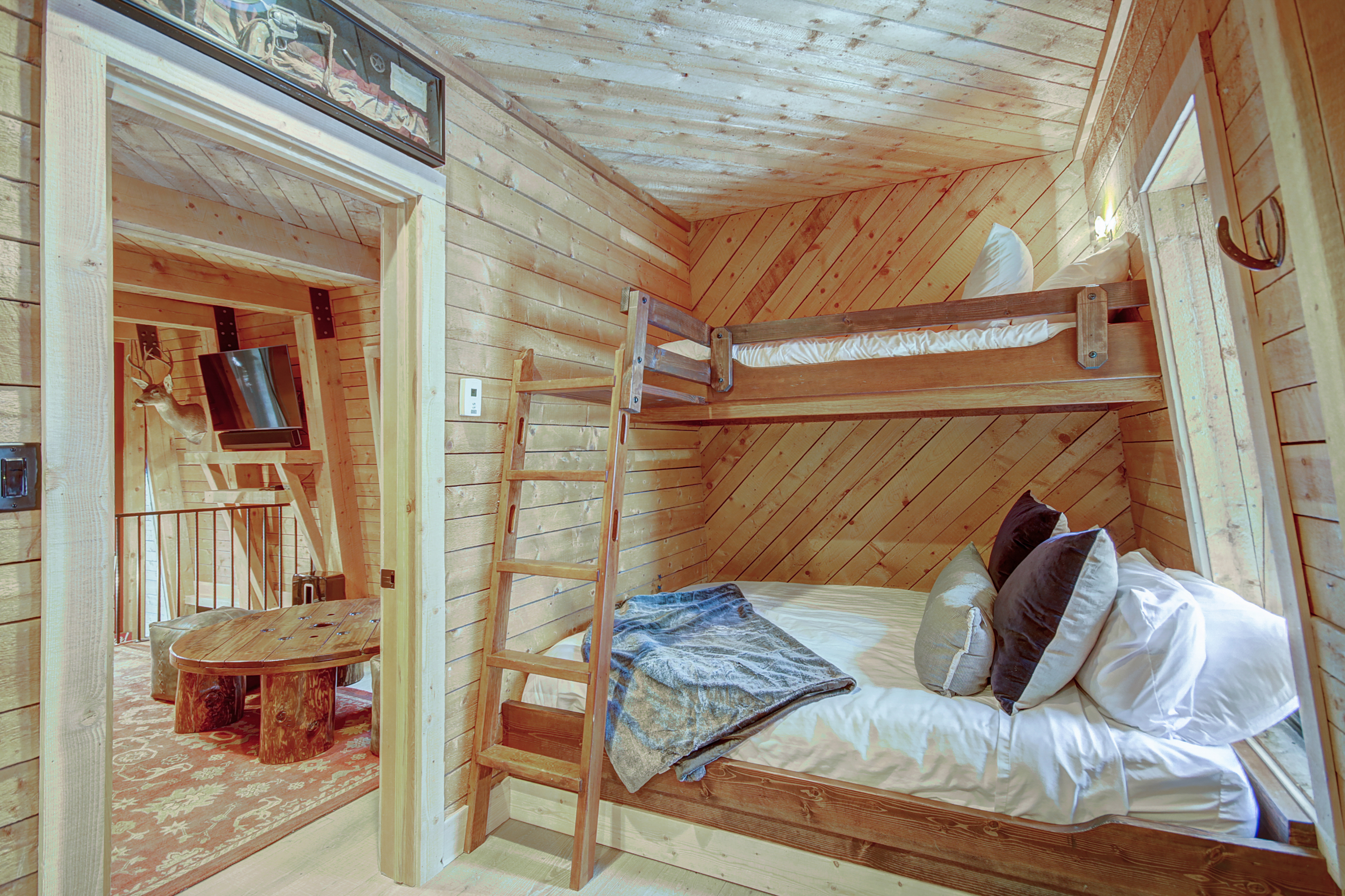 Upper level bunk room with Twin over Queen bunks and Twin size sleeper chair