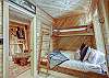 Upper level bunk room with Twin over Queen bunks and Twin size sleeper chair - Arrow Darrow Breckenridge Vacation Rental 