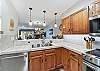 Kitchen overlooking the dining and living areas - Atrium 108 Breckenridge Vacation Rental 