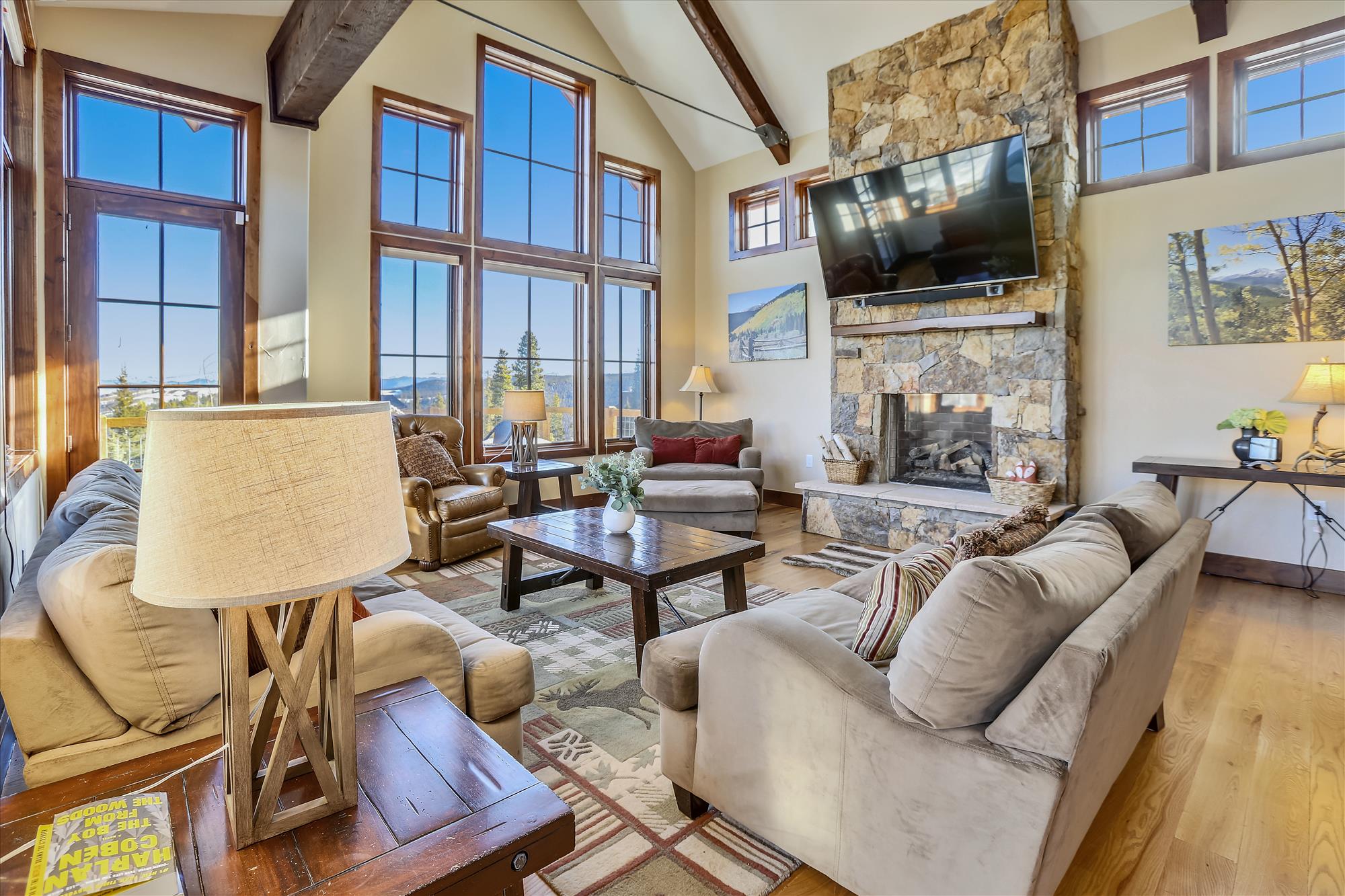 Your group can take in the mountain views or a show in this cozy living room