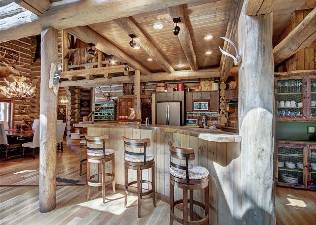 View from the island bar into the spacious kitchen and dining area - Bear Lodge Breckenridge Vacation Rental