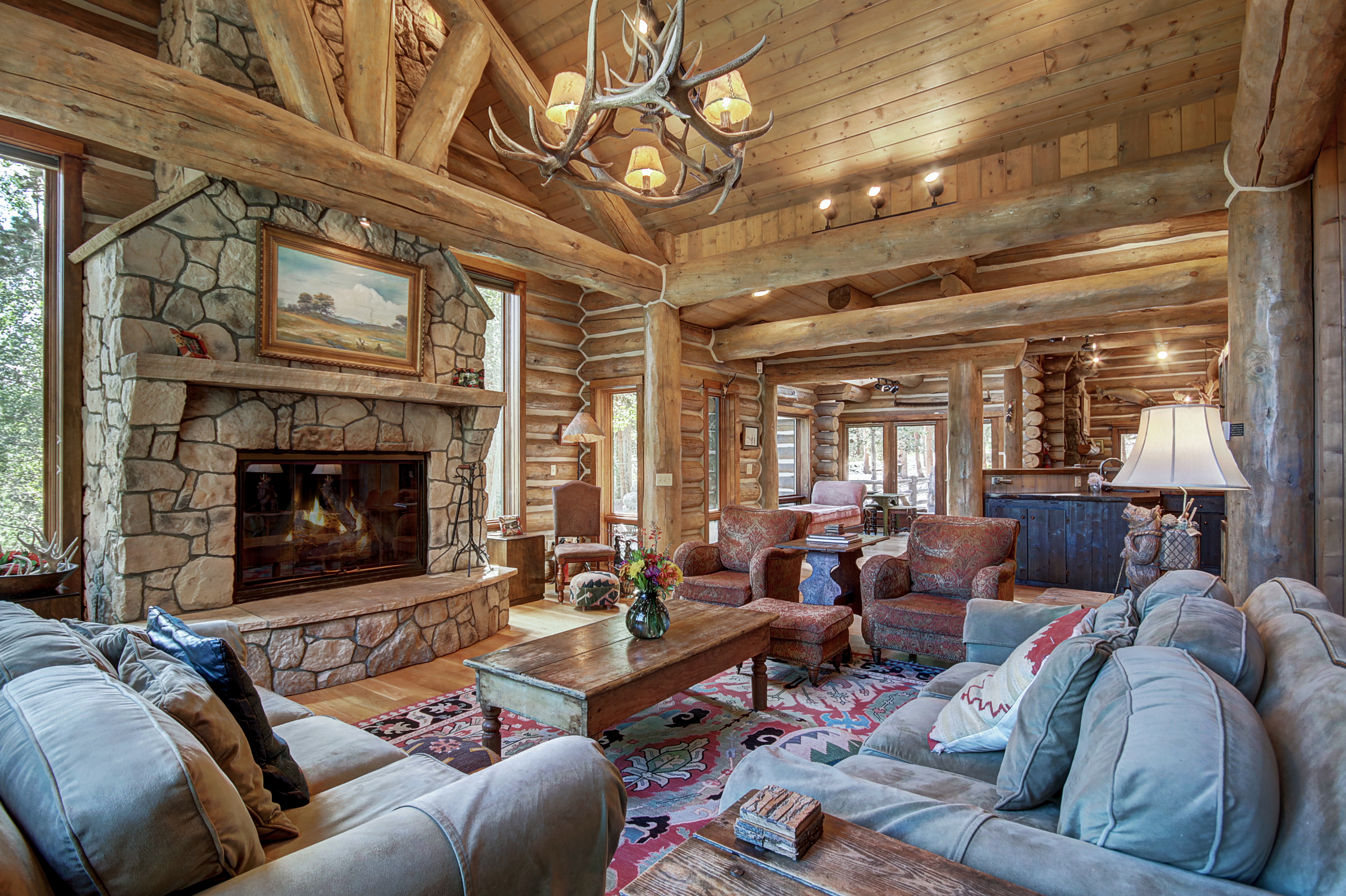 The living area offers a large gas fireplace with plenty of space to sit and warm up - Bear Lodge Breckenridge Vacation Rental
