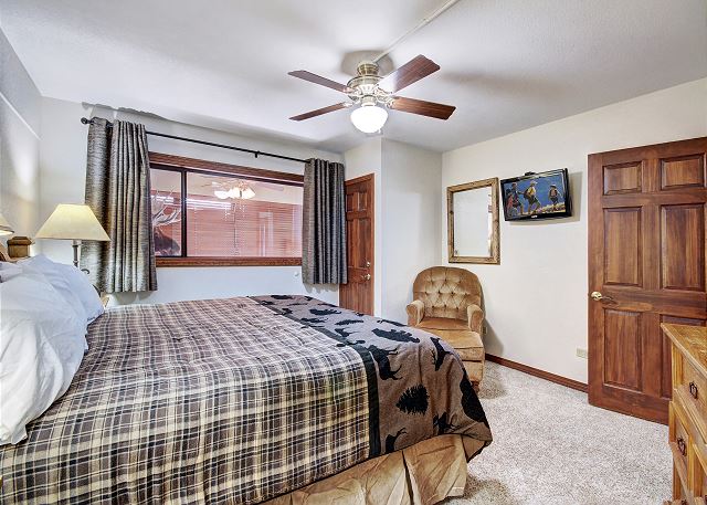 This master bedroom has a private bathroom, television and king bed for all of the relaxation and privacy you need. - Beaver Run Black Diamond Penthouse Breckenridge Vacation Rental