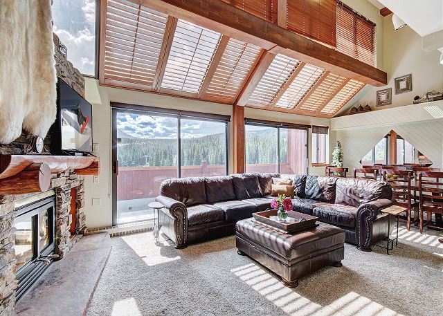 Warm by the gas fireplace in the living room. - Beaver Run Black Diamond Penthouse Breckenridge Vacation Rental