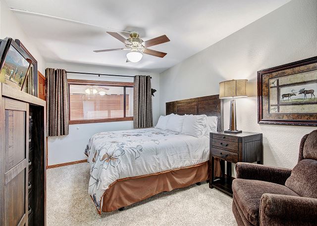 Upper level master bedroom with king bed, flat screen TV and en-suite bathroom. - Beaver Run Black Diamond Penthouse Breckenridge Vacation Rental