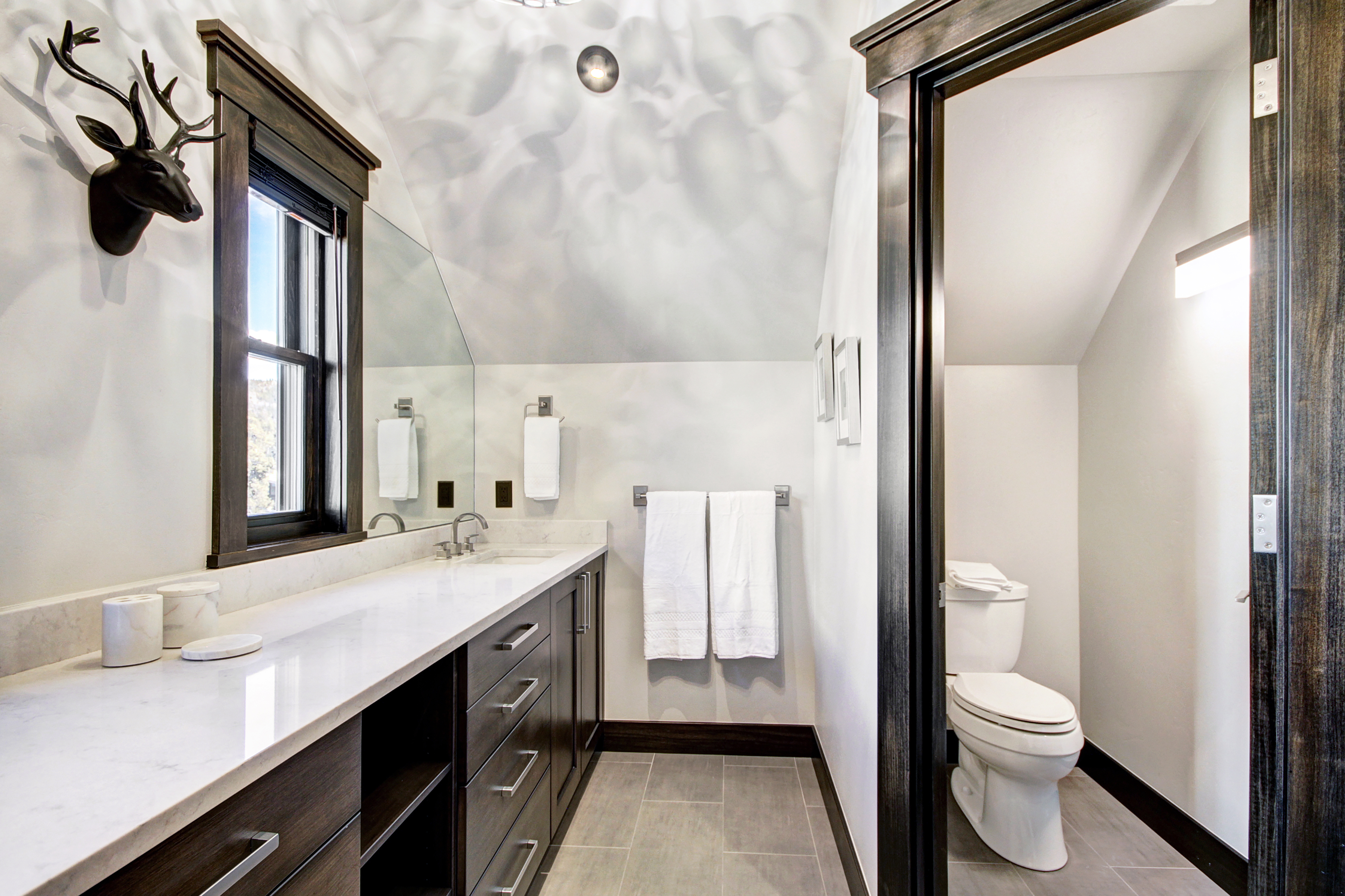 The master bathroom also offers dual vanity and a private toilet. -  The Bogart House Breckenridge Vacation Rental
