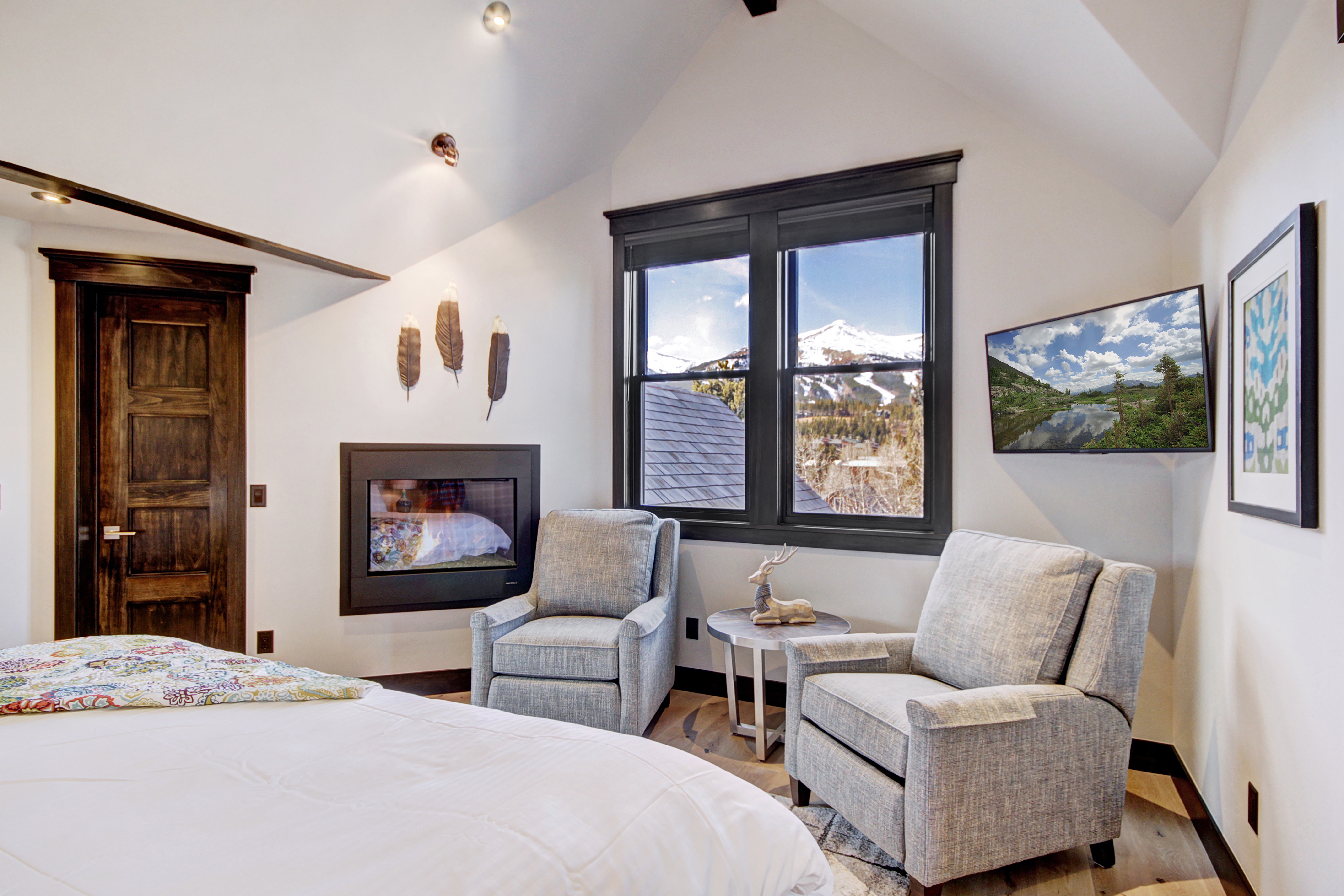 The small seating area in the upper level master bedroom is the perfect place to warm by the fire. -  The Bogart House Breckenridge Vacation Rental
