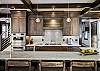 Granite counter tops feature nicely in the kitchen where there's seating for 6 -  The Bogart House Breckenridge Vacation Rental 