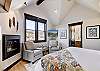 The upper level master suite offers a king bed, gas fireplace and flat screen TV -  The Bogart House Breckenridge Vacation Rental 