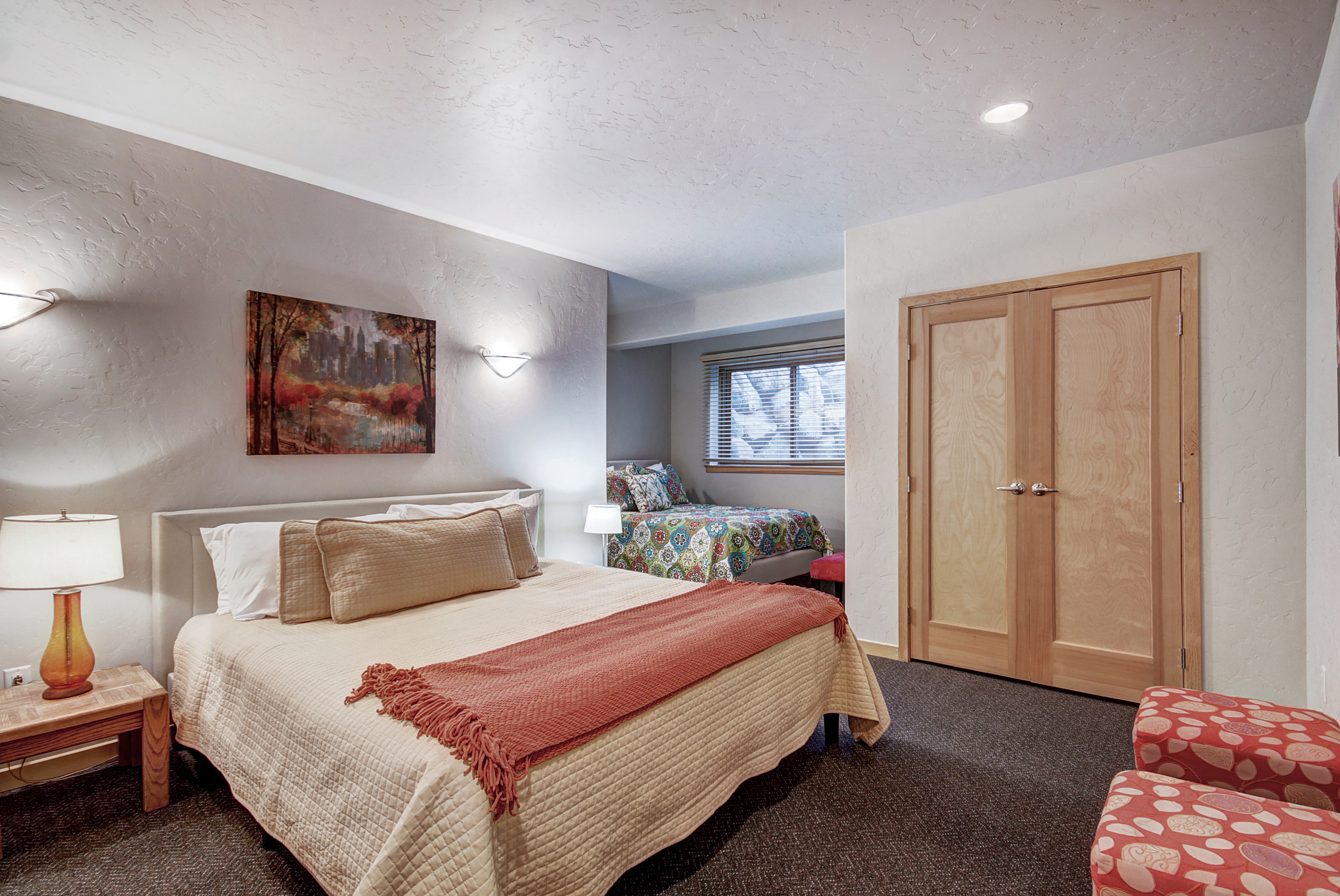Lower level bedroom with a king and a queen bed with en-suite bathroom. - Buffalo Mountain Vista Frisco Vacation Rental