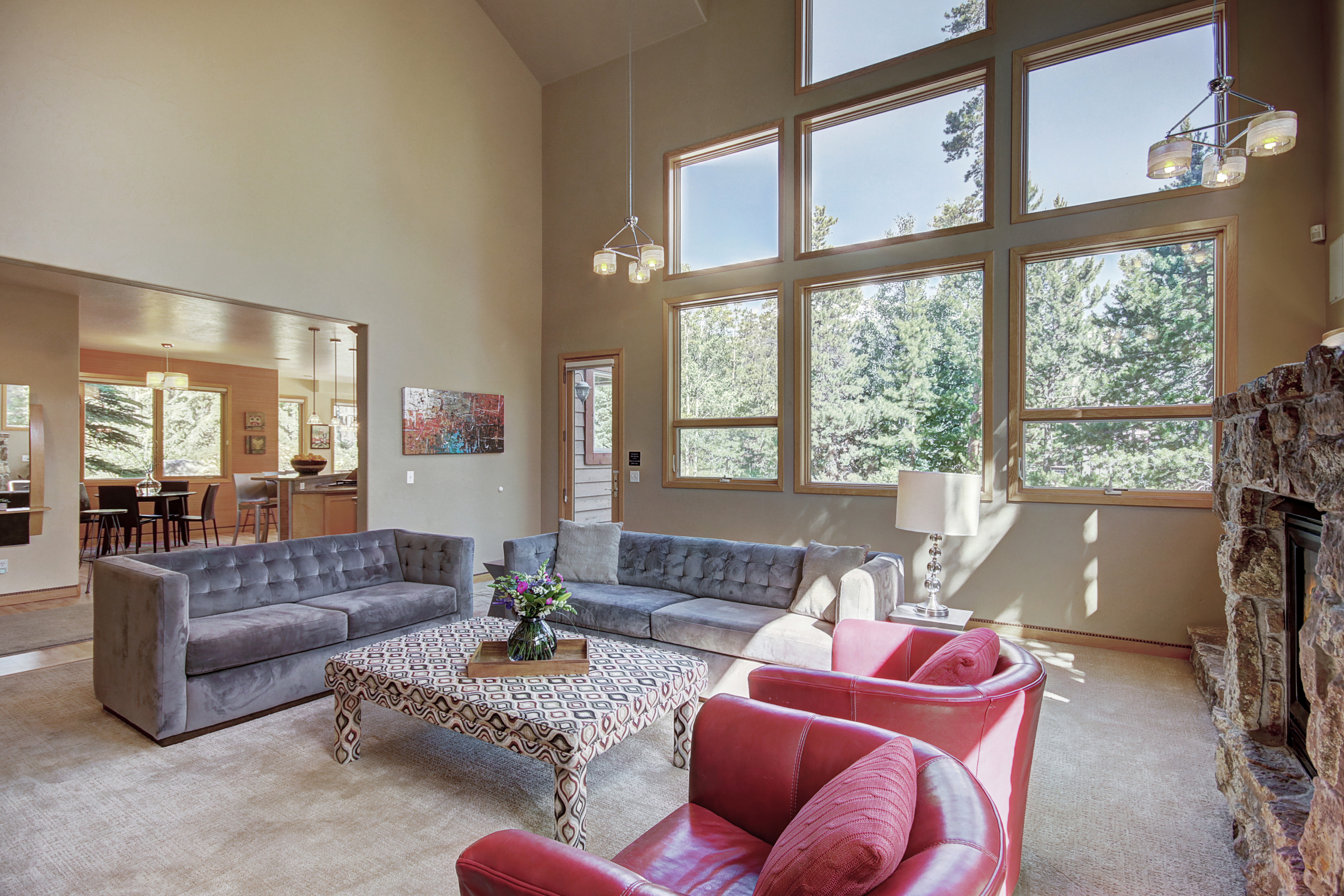 The large windows in the living room allow natural light to flow through. - Buffalo Mountain Vista Frisco Vacation Rental