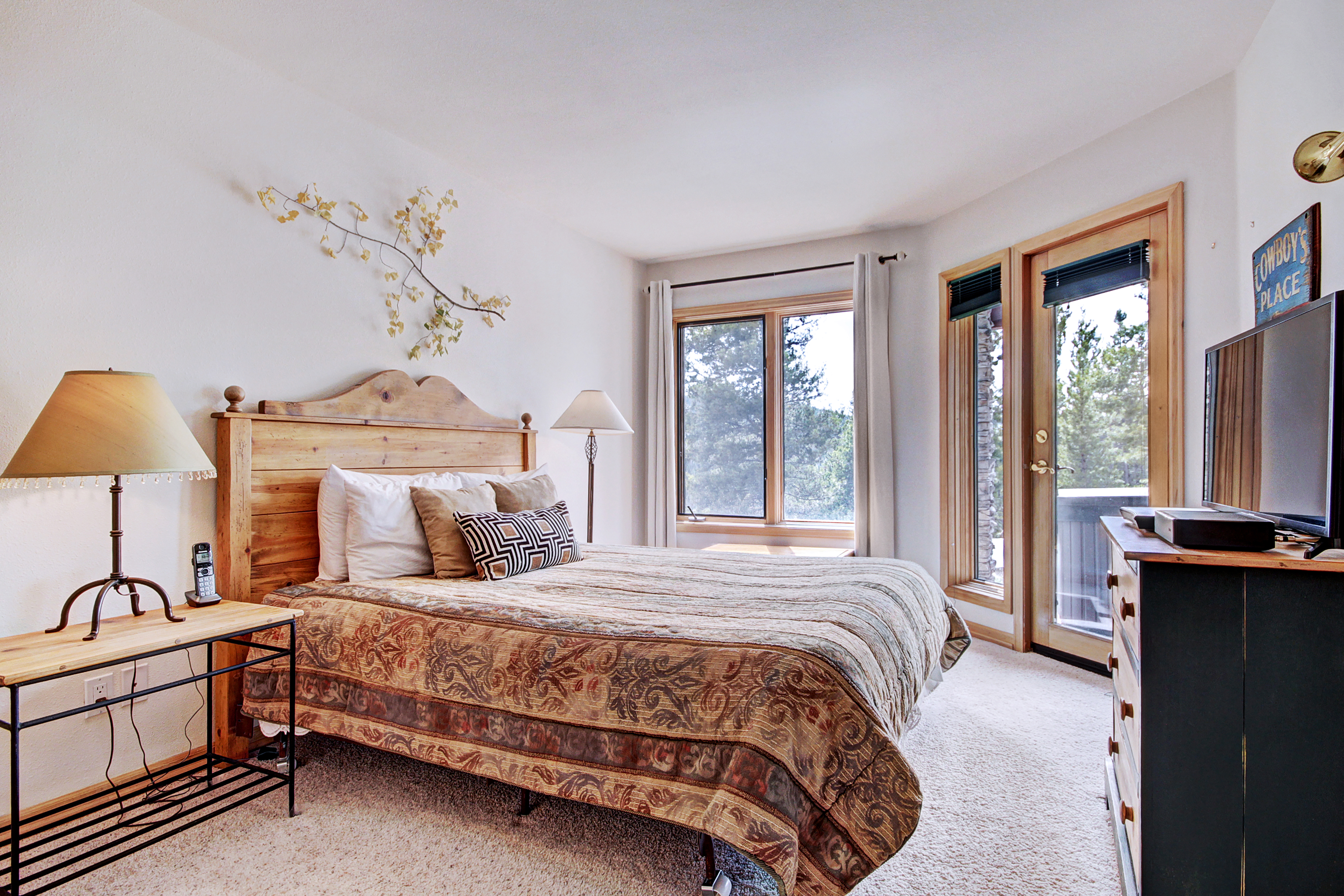 Lower level bedroom with Queen-size bed and private bath + patio/hot tub access.