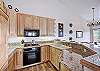 Contemporary kitchen with upgraded appliances and granite counter tops. - Charter Ridge 60 Breckenridge Vacation Rental 