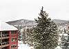 Enjoy the snowy views from your private patio. - Cimarron 301 Breckenridge Vacation Rental 