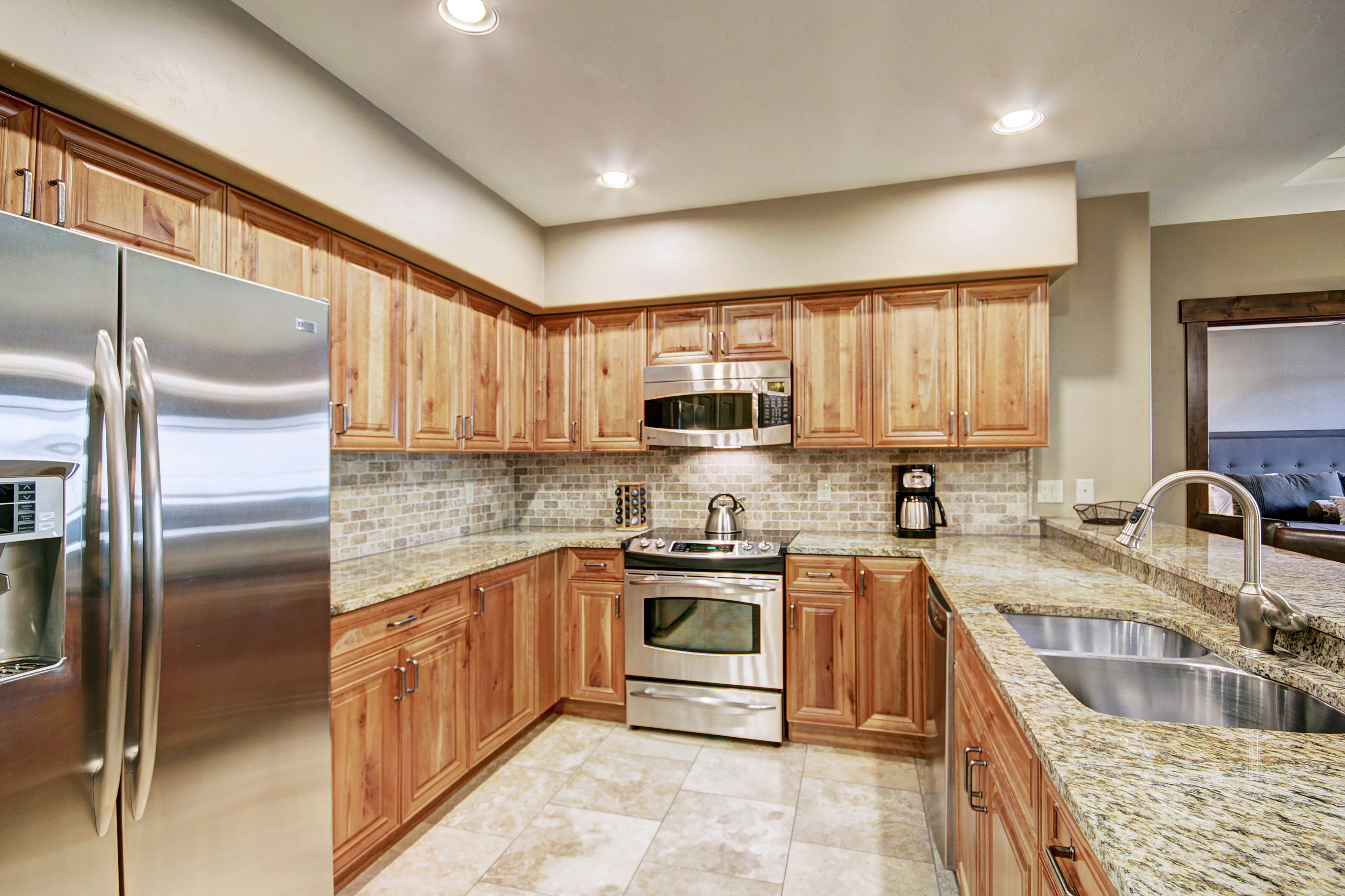 The well-equipped kitchen has a 12 cup coffee maker, toaster & slow cooker.