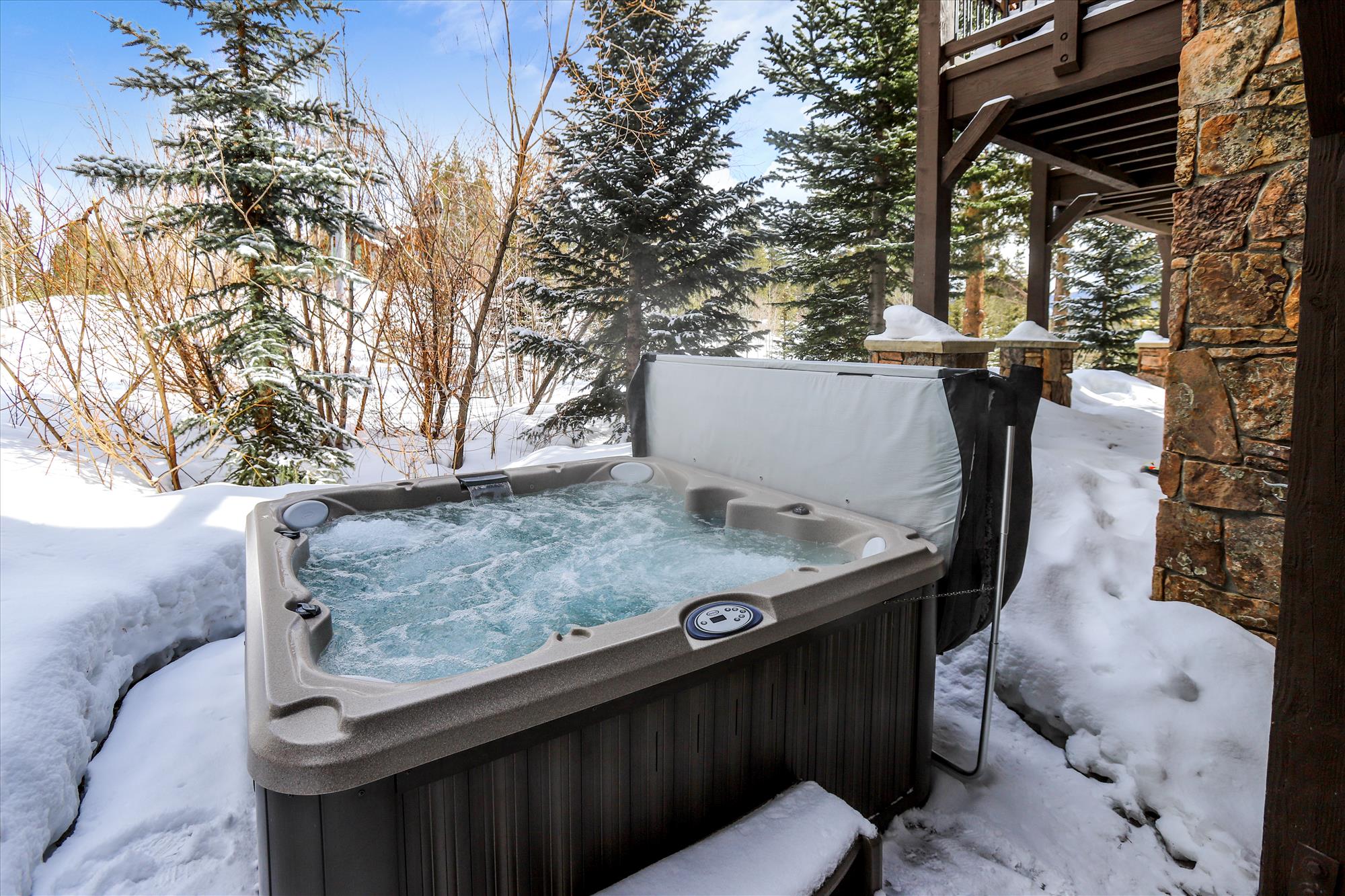 Relax your muscles after a long day on the slopes in this private hot tub.