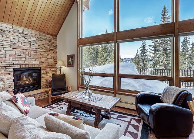 Main living area with gorgeous floor to ceiling windows and gas fireplace - Lodge at Boreas Pass Breckenridge Vacation Rental