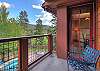 Balcony view of mountains and community hot tub (one of many hot tubs on site)