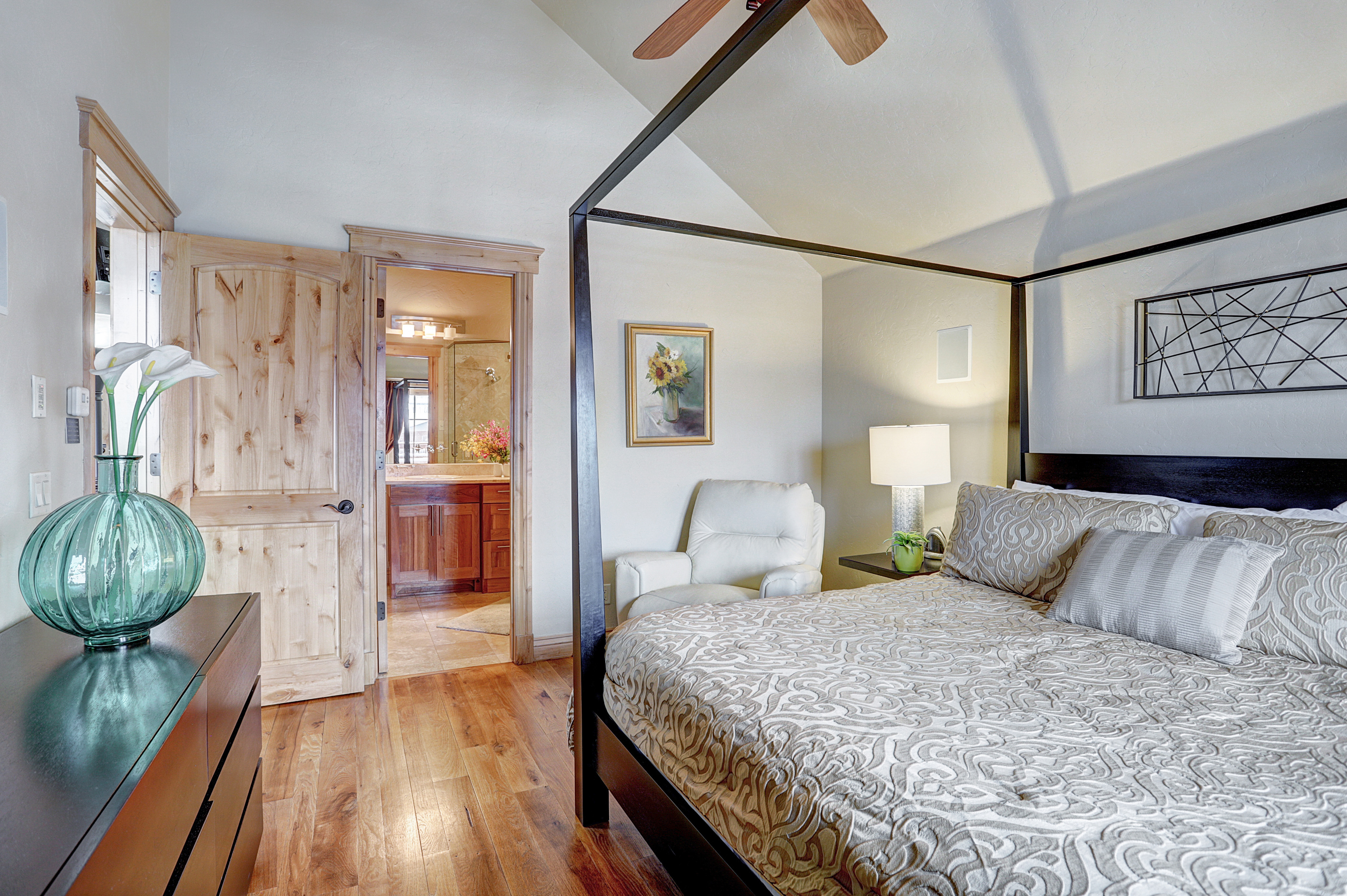 Upper level master bedroom with King-size bed, flat screen TV, and private bath