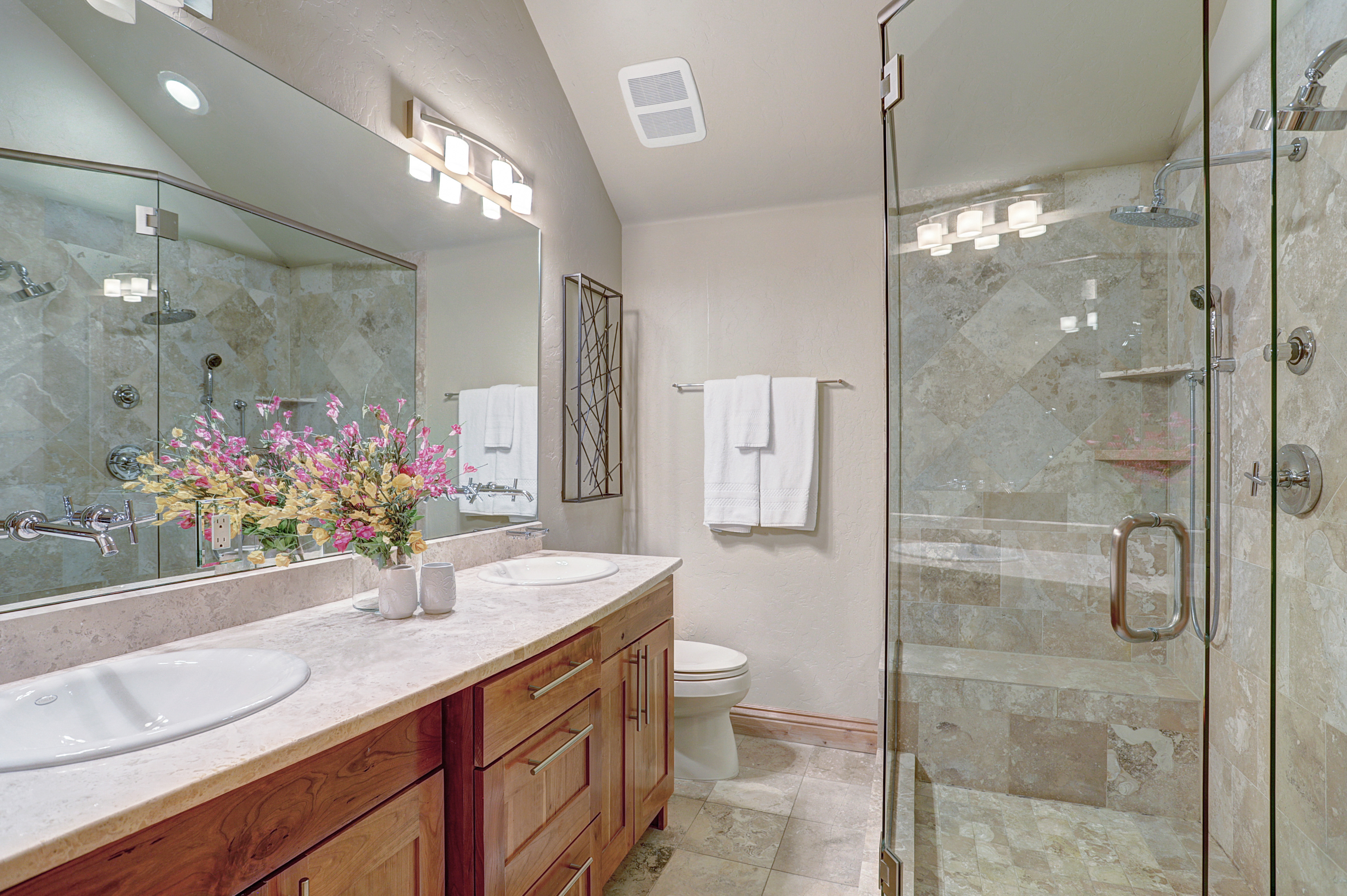 Master private bathroom with walk-in double shower head and 2 sinks